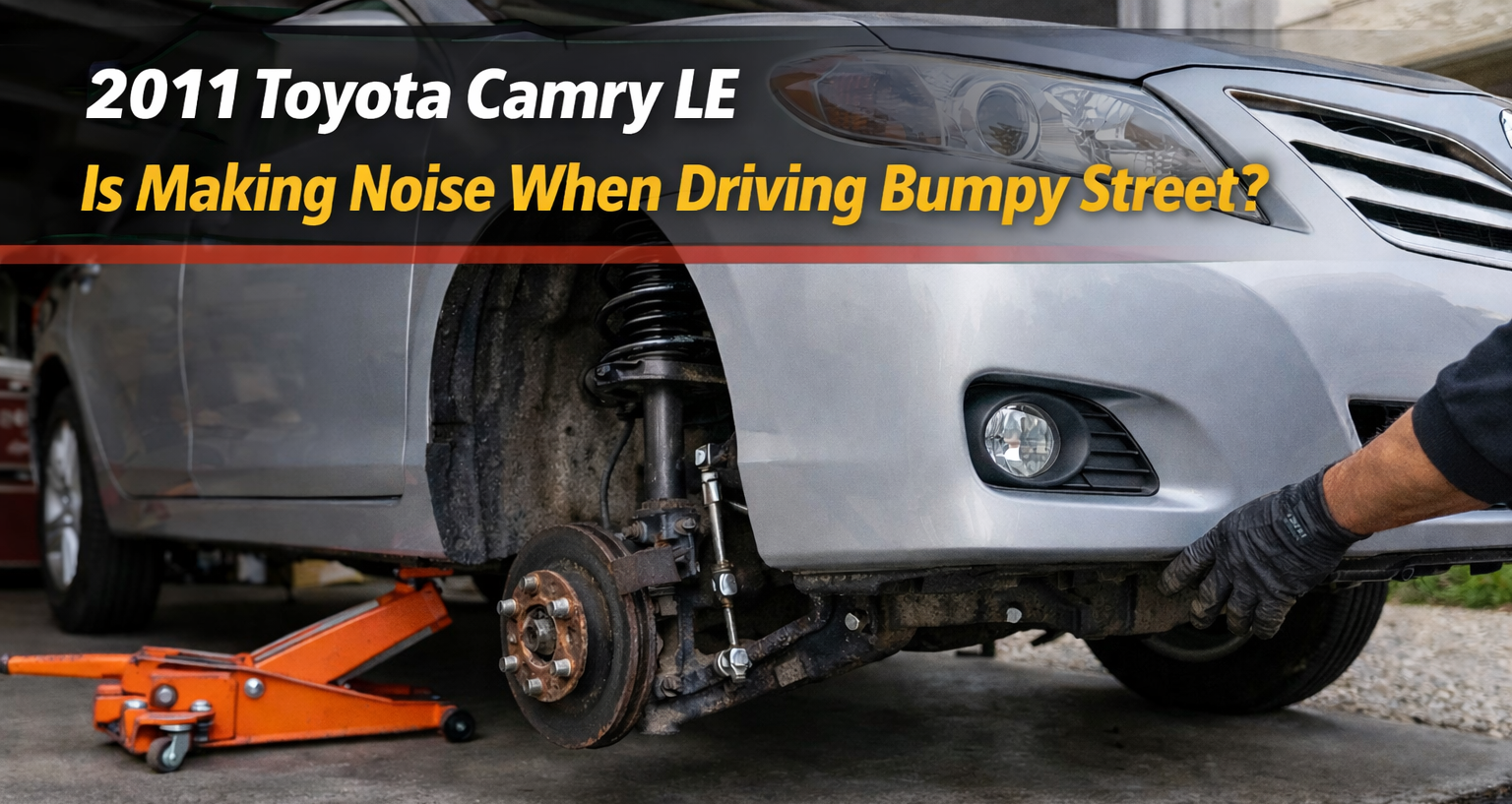 2011 Toyota Camry LE suspension exposed with strut and stabilizer link visible explaining why it rattles over bumps on rough roads