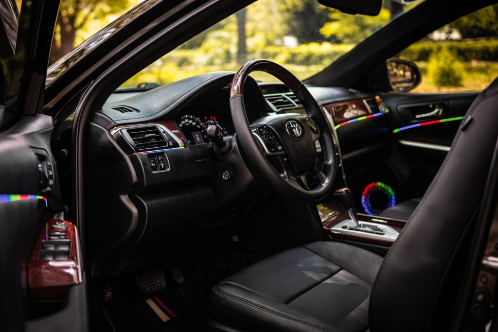 Is the Toyota Camry a Luxury Car? Premium Toyota Camry interior with leather seats, wood trim, and upscale features.