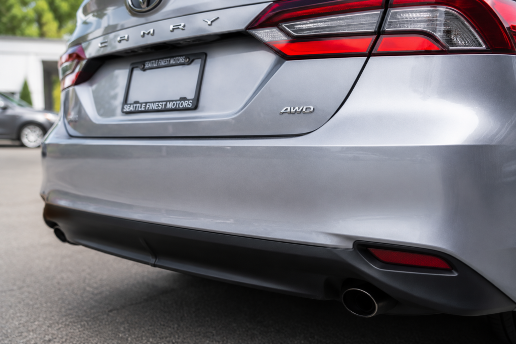 Toyota Camry AWD badge on rear bumper showing all wheel drive trim